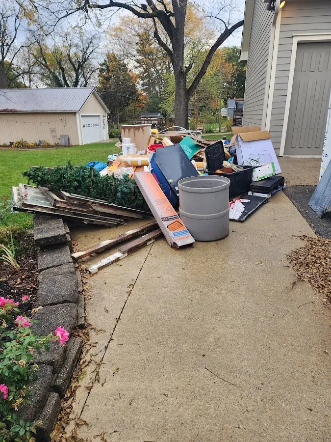 Dumpster being loaded with debris for 30 Yard Dumpster Rental in New Rochelle